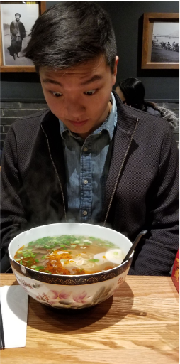 Jeremy with a bowl of ramen